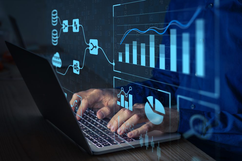Analyst working with a Data Management System on a computer to make report with KPI and metrics connected to database. Corporate strategy for finance, operations, sales, marketing