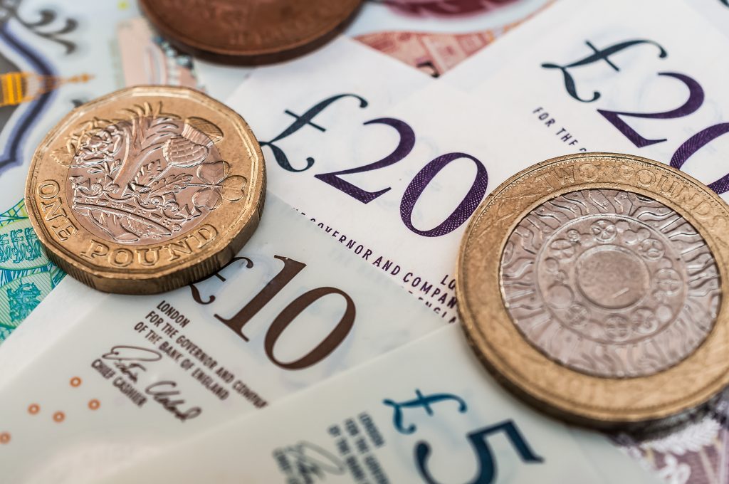 This image shows British pounds banknotes and coins.